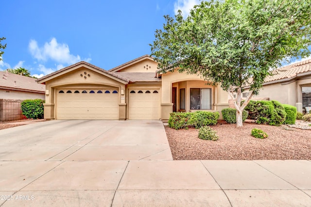 1422 E Ebony Dr, Chandler, AZ 85286 - mediterranean / spanish-style house featuring driveway, stucco siding, a tile roof, and a garage