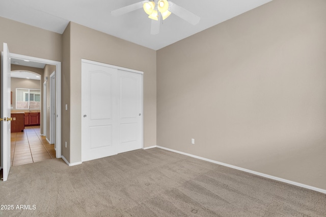 1422 E Ebony Dr, Chandler, AZ 85286 - unfurnished bedroom featuring light carpet, a closet, baseboards, and ceiling fan