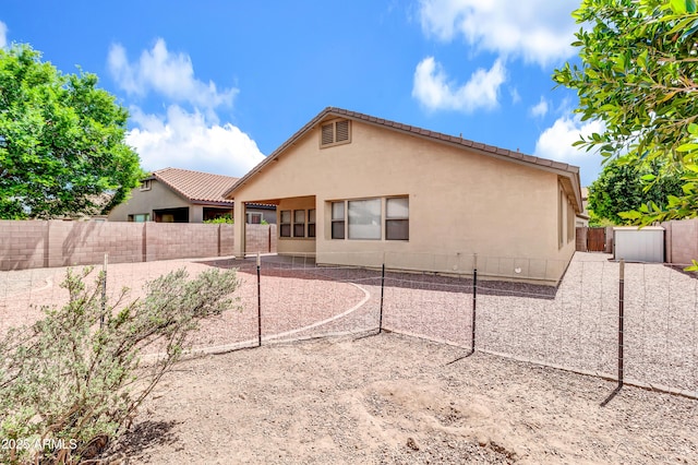1422 E Ebony Dr, Chandler, AZ 85286 - back of house featuring a patio area, a fenced backyard, and stucco siding