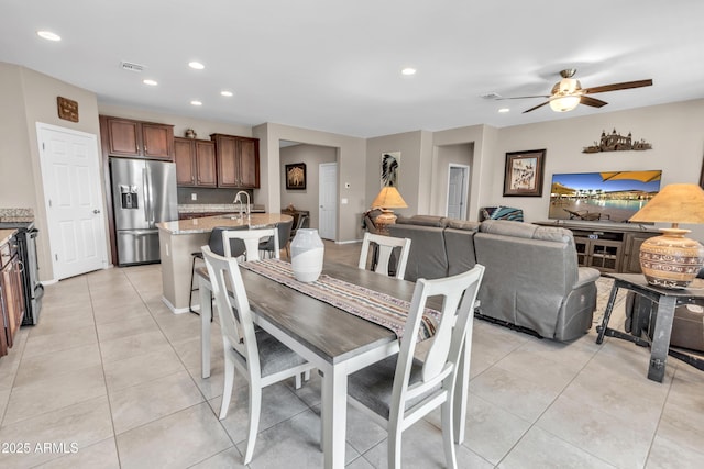 dining room featuring light tile patterned flooring, visible vents, recessed lighting, and a ceiling fan