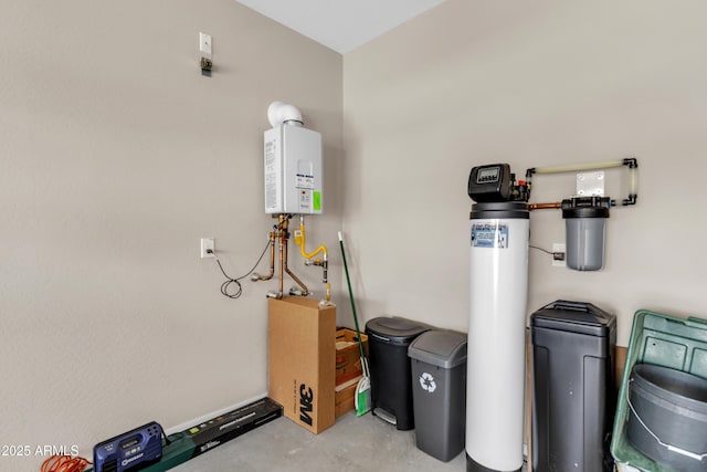 utility room featuring tankless water heater