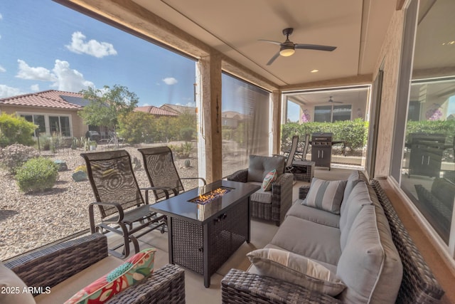 view of patio with an outdoor living space with a fire pit, a grill, and ceiling fan