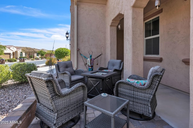 view of patio with a fire pit