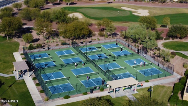 birds eye view of property with view of golf course