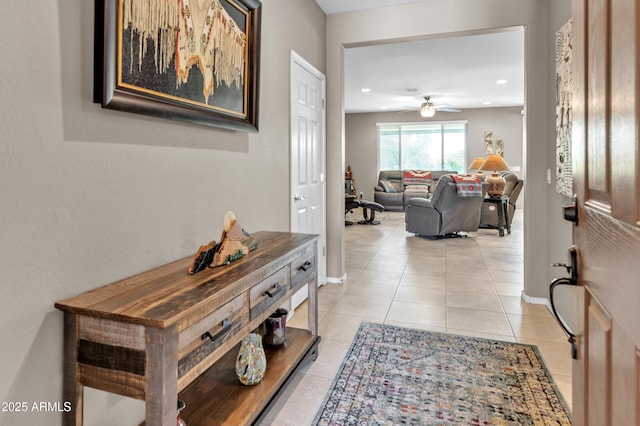 foyer entrance with light tile patterned floors, baseboards, recessed lighting, and a ceiling fan