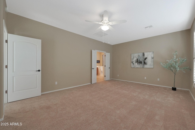 unfurnished bedroom featuring ceiling fan and light carpet