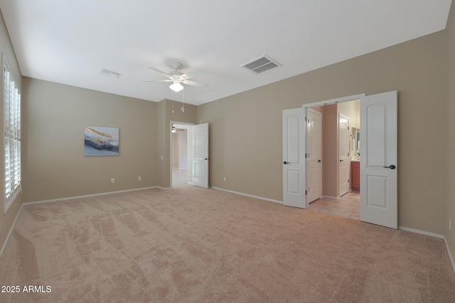 unfurnished bedroom with light carpet and ceiling fan