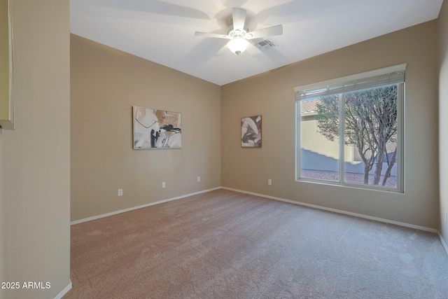 empty room featuring light carpet and ceiling fan