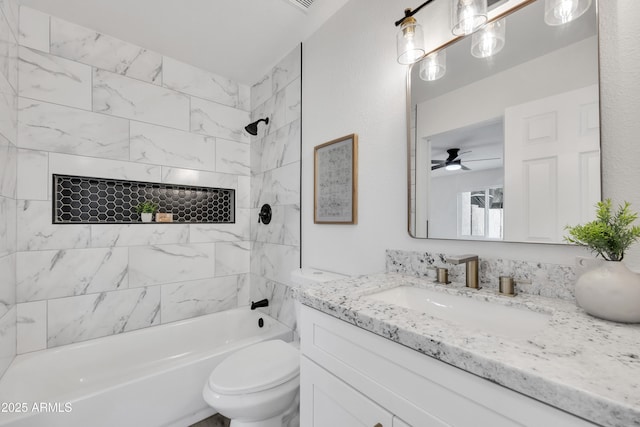 bathroom with bathing tub / shower combination, toilet, and vanity