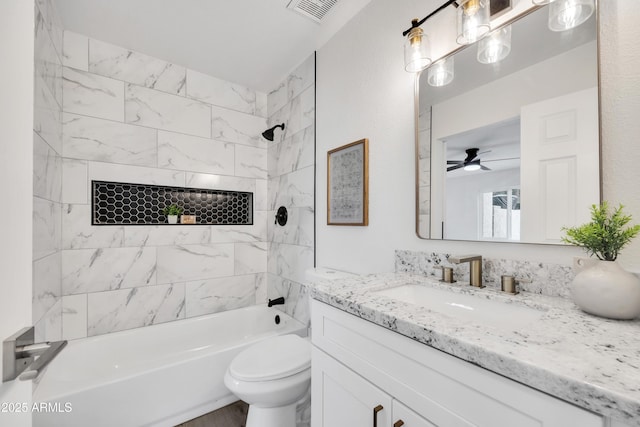 bathroom with toilet, bathtub / shower combination, visible vents, and vanity