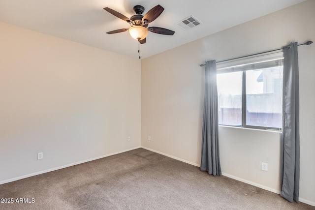 unfurnished room with a ceiling fan, carpet, visible vents, and baseboards