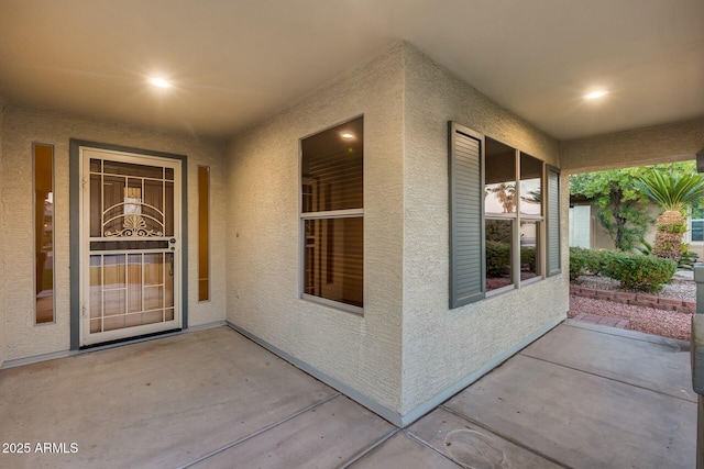 doorway to property featuring a patio area