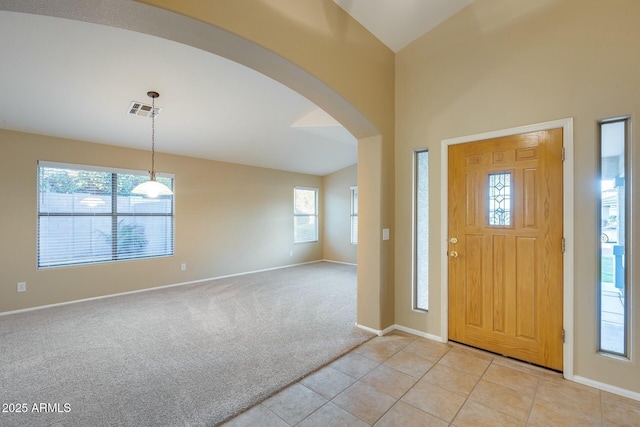 view of carpeted entrance foyer