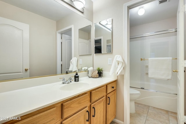 full bathroom with vanity, tile patterned floors, toilet, and combined bath / shower with glass door