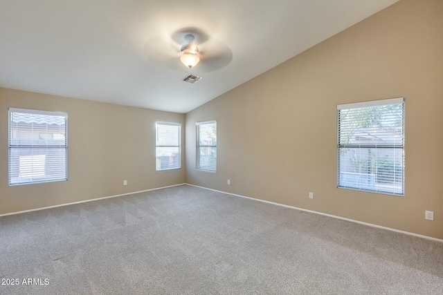 unfurnished room with ceiling fan, lofted ceiling, and carpet