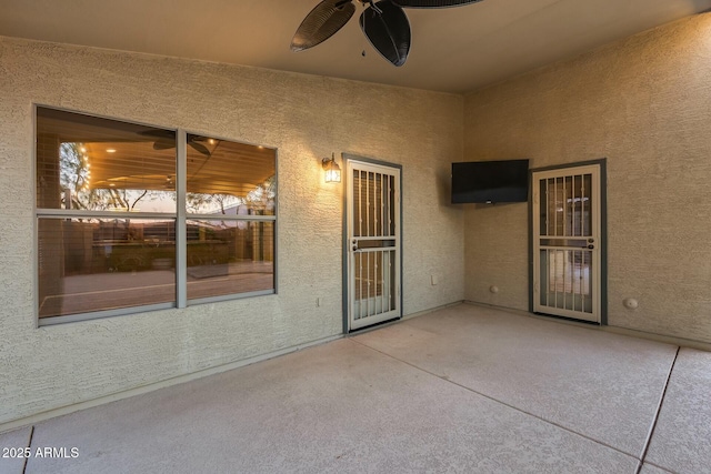 view of patio / terrace featuring ceiling fan