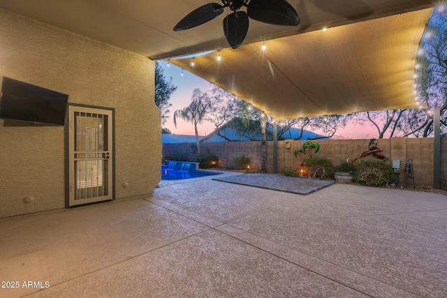 patio terrace at dusk with ceiling fan