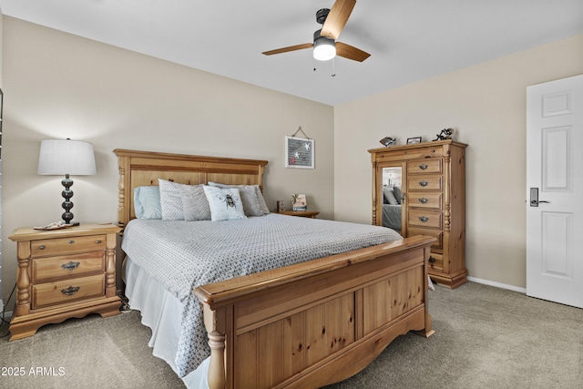 bedroom with a ceiling fan and light colored carpet
