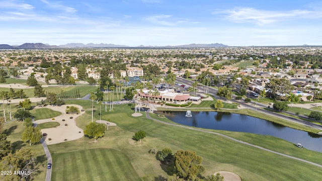 aerial view featuring a water and mountain view, view of golf course, and a residential view