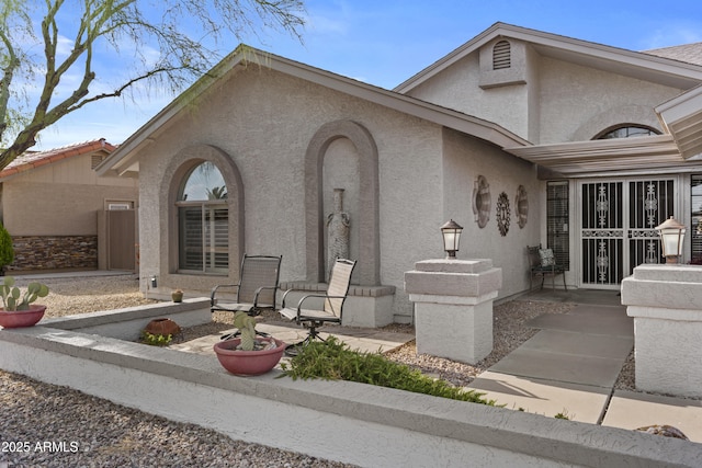 view of front of house featuring stucco siding