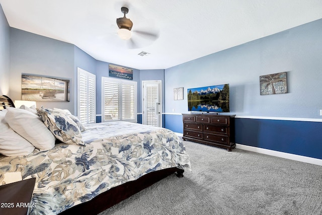 bedroom featuring baseboards, light carpet, visible vents, and ceiling fan