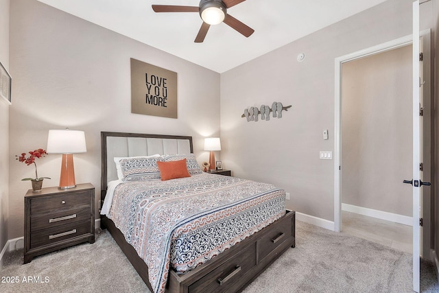 bedroom with light colored carpet, baseboards, and ceiling fan