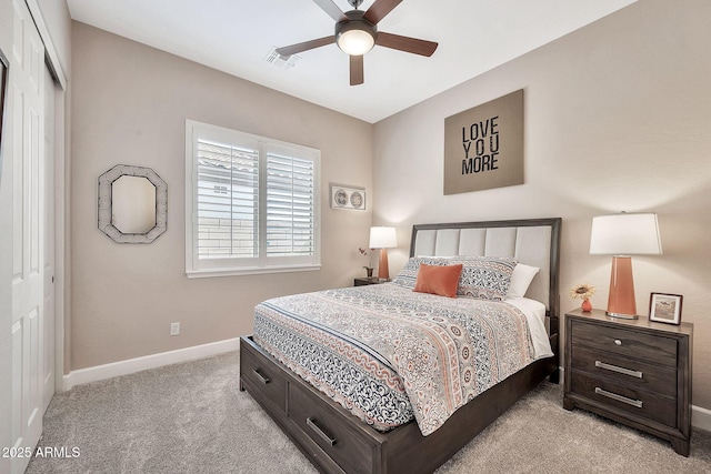 bedroom with visible vents, light carpet, a ceiling fan, a closet, and baseboards