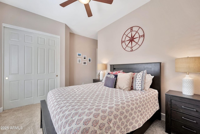 bedroom featuring a ceiling fan, carpet, and lofted ceiling