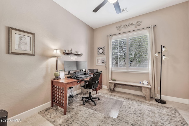 home office featuring tile patterned floors, baseboards, visible vents, and ceiling fan