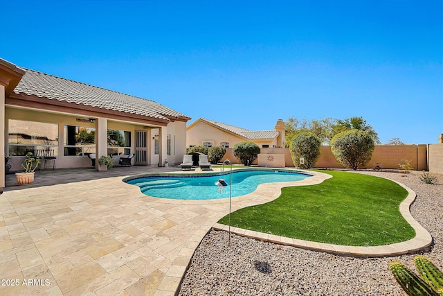 view of pool with a patio area, a fenced in pool, and a fenced backyard