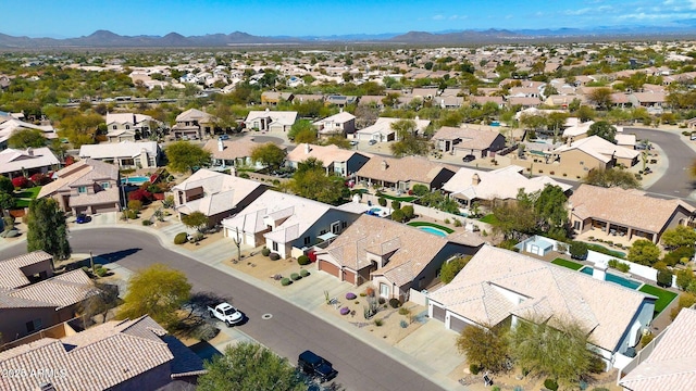 birds eye view of property with a mountain view and a residential view