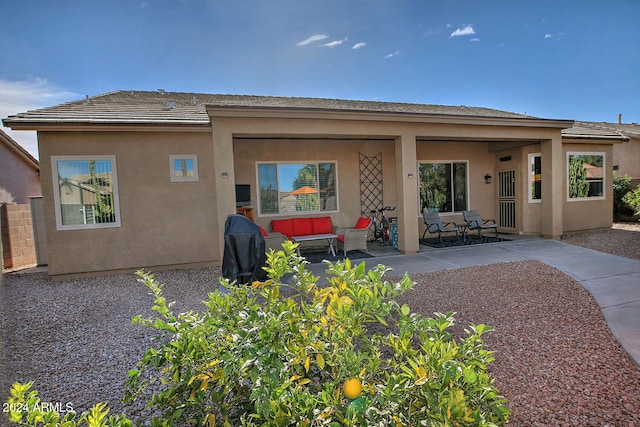 back of house with a patio