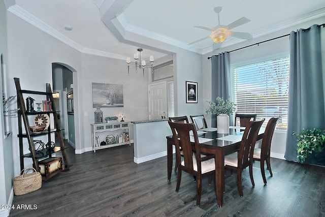 dining space featuring dark hardwood / wood-style floors, ornamental molding, and ceiling fan with notable chandelier