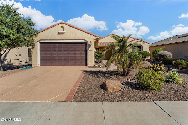 mediterranean / spanish-style house featuring a garage