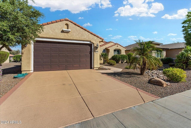 mediterranean / spanish-style house featuring a garage