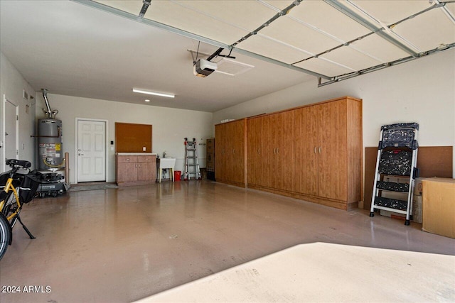 garage with water heater and a garage door opener