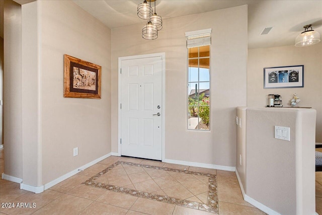 foyer entrance featuring light tile patterned floors