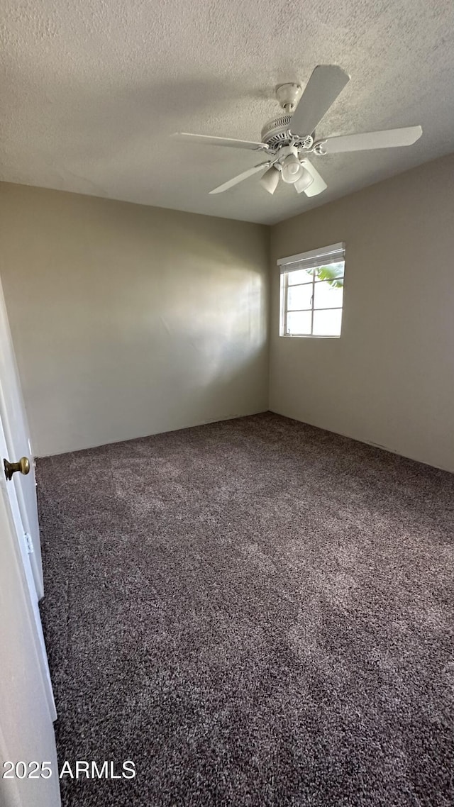 unfurnished room featuring carpet, a textured ceiling, and ceiling fan