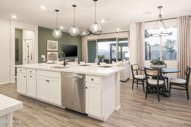 19022 W Rose Ln, Waddell, AZ 85355 - kitchen featuring a sink, open floor plan, dishwasher, and a chandelier