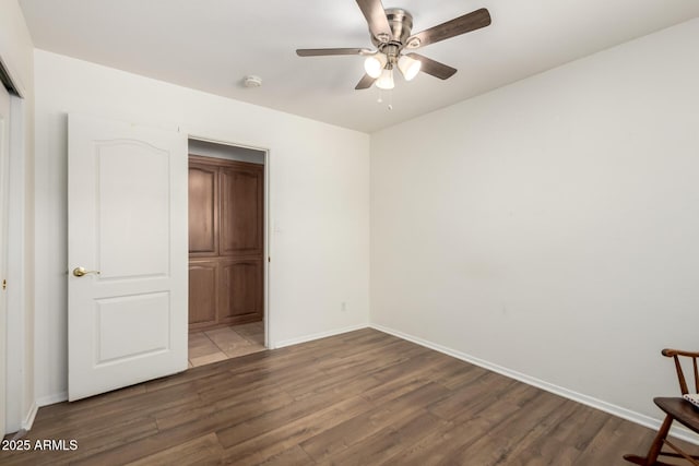 8538 E Vista Dr, Scottsdale, AZ 85250 - unfurnished bedroom with wood finished floors and ceiling fan