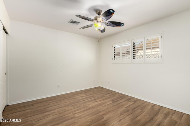 8538 E Vista Dr, Scottsdale, AZ 85250 - spare room with ceiling fan and wood finished floors