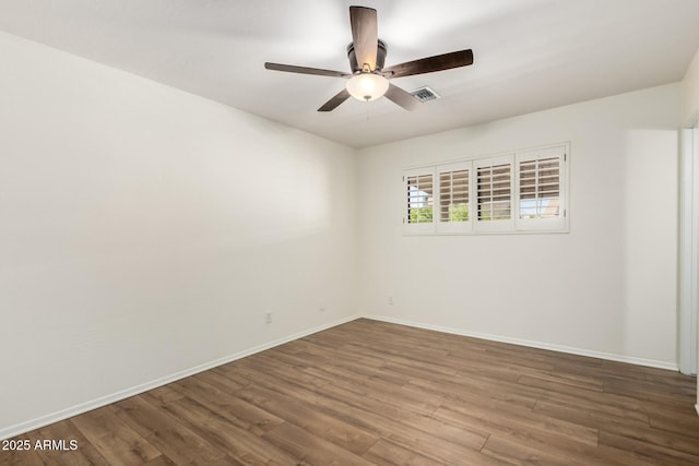 8538 E Vista Dr, Scottsdale, AZ 85250 - empty room featuring ceiling fan and wood finished floors