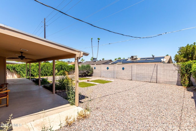 8538 E Vista Dr, Scottsdale, AZ 85250 - fenced backyard featuring a ceiling fan and a patio area