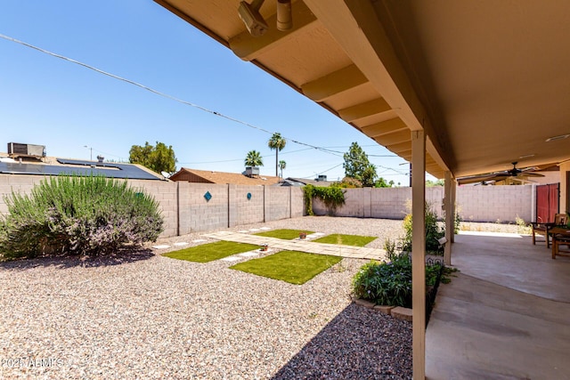 8538 E Vista Dr, Scottsdale, AZ 85250 - fenced backyard featuring a patio area and a ceiling fan