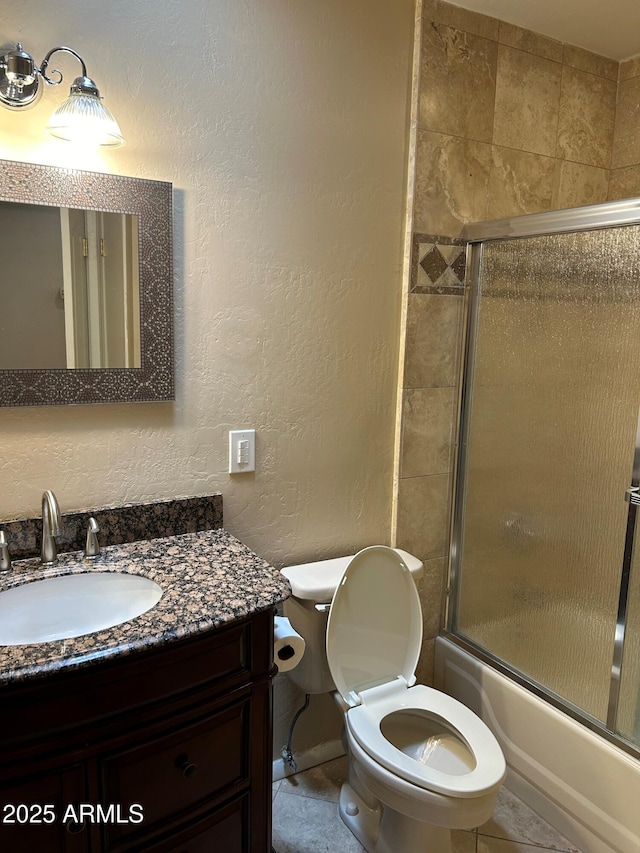 8538 E Vista Dr, Scottsdale, AZ 85250 - full bathroom featuring vanity, shower / bath combination with glass door, and a textured wall