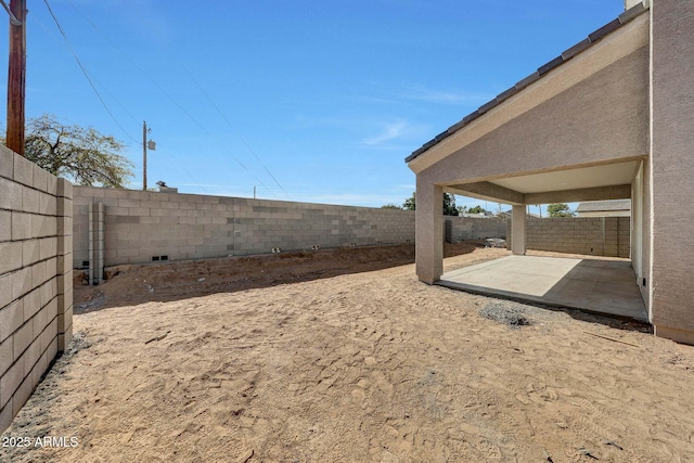 view of yard with a patio area and a fenced backyard