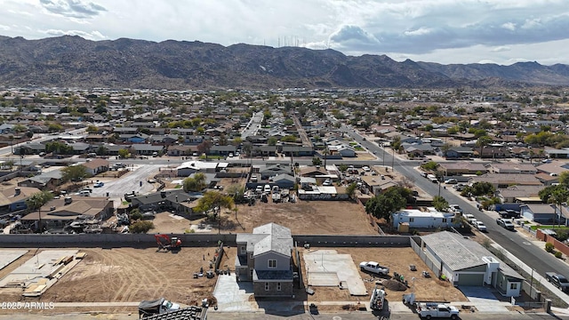 birds eye view of property with a residential view and a mountain view