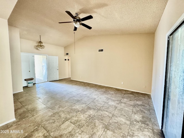 unfurnished room with visible vents, ceiling fan with notable chandelier, a textured ceiling, and lofted ceiling