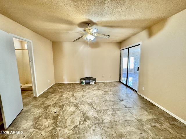 unfurnished room with a textured ceiling, baseboards, and ceiling fan