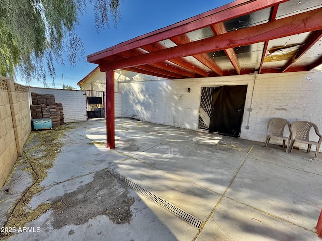 view of patio / terrace featuring fence